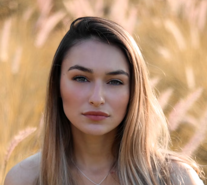 Woman with long hair standing in a golden field
